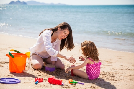 Mom with her daughter at the beach