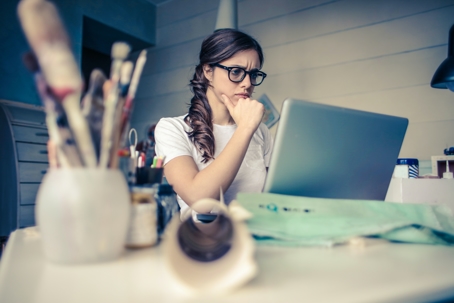 woman in studio looking at laptop